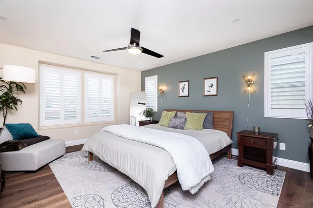 a bedroom with a large bed and a couch