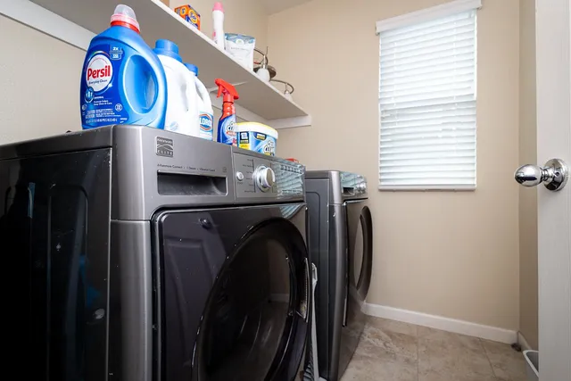 a utility room with dryer and washer