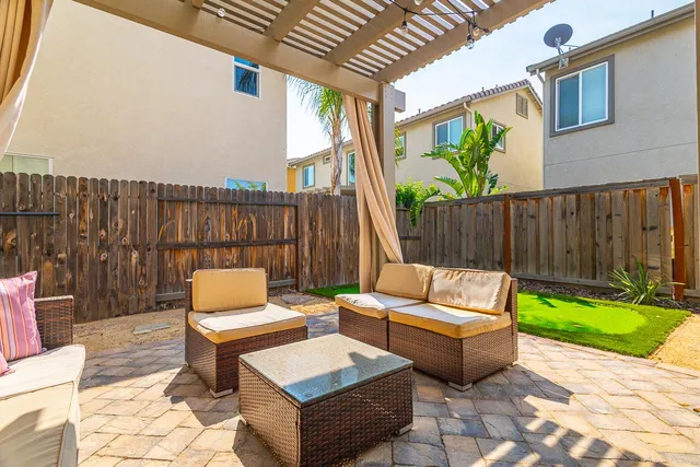 a outdoor living space with patio furniture and garden view