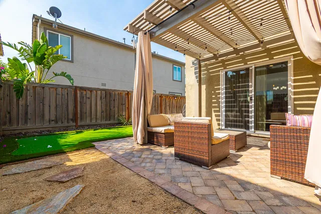 a view of backyard with a patio