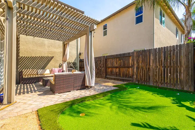 a view of backyard with green space