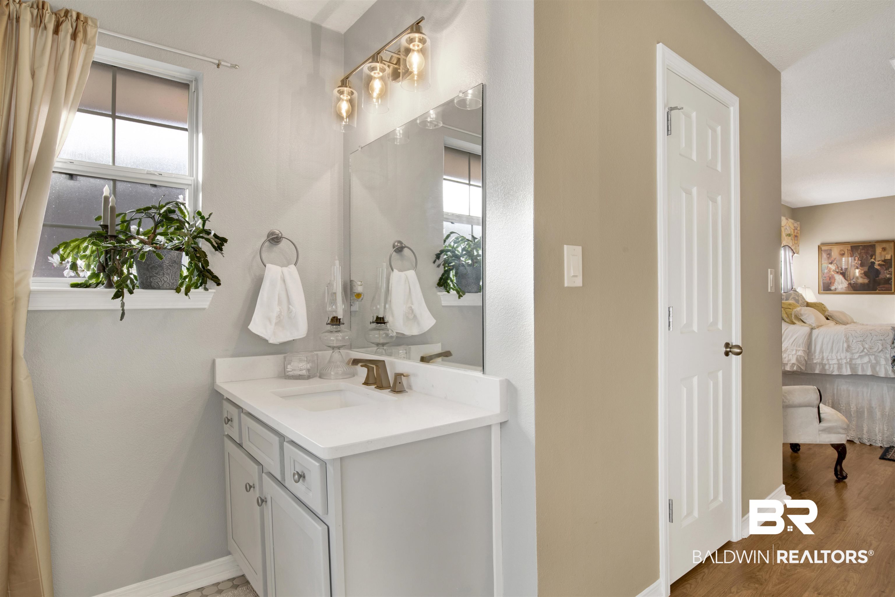 11697 Balsam Court Daphne, AL 36527 - Photo 19 of 31 Bathroom featuring vanity and wood-type flooring