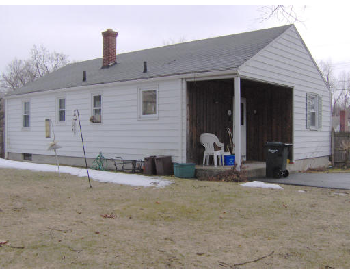 196 Navajo Road Springfield, MA 01109 - Photo 2 of 3 a view of a house with a patio