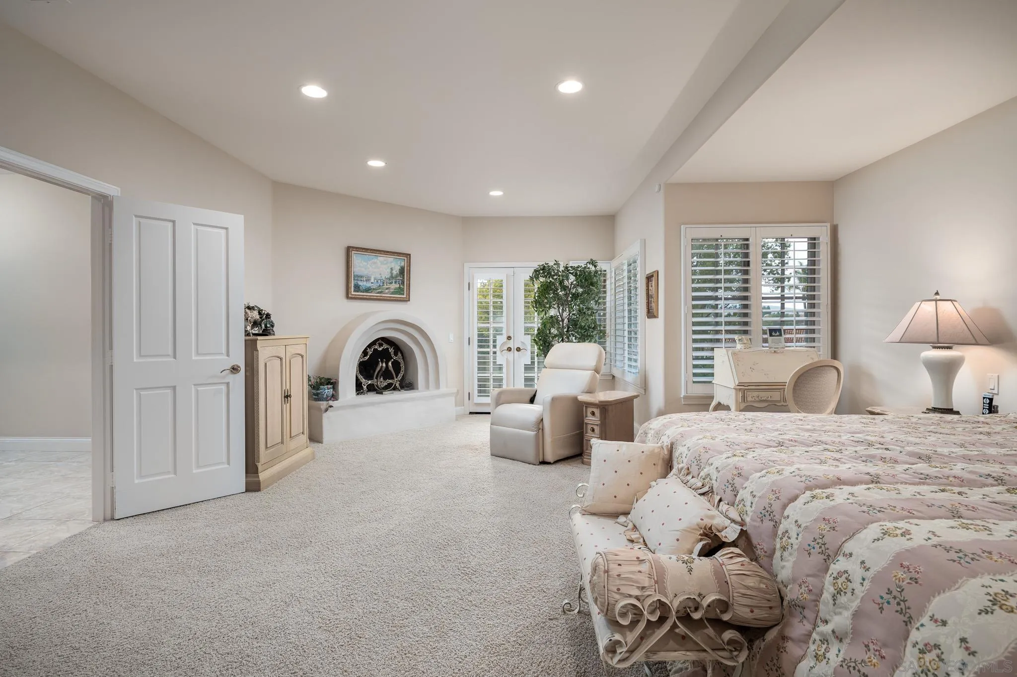 18221 Via Ascenso Rancho Santa Fe, CA 92067 - Photo 21 of 37 a bedroom with bed and a large window