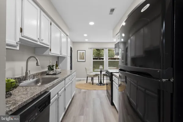 a kitchen with granite countertop lots of counter top space