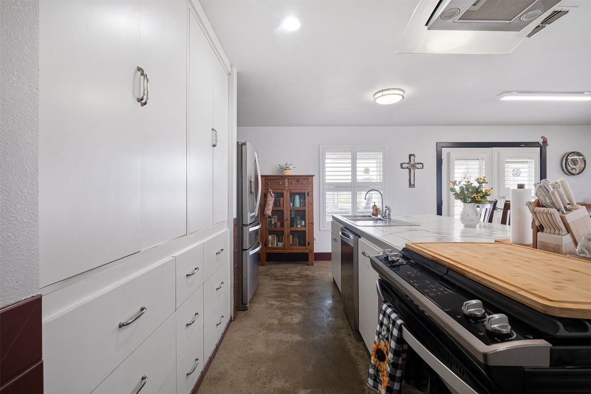 142 Zimmerhanzel Road Flatonia, TX 78941 - Photo 12 of 40 a kitchen with sink stove and refrigerator