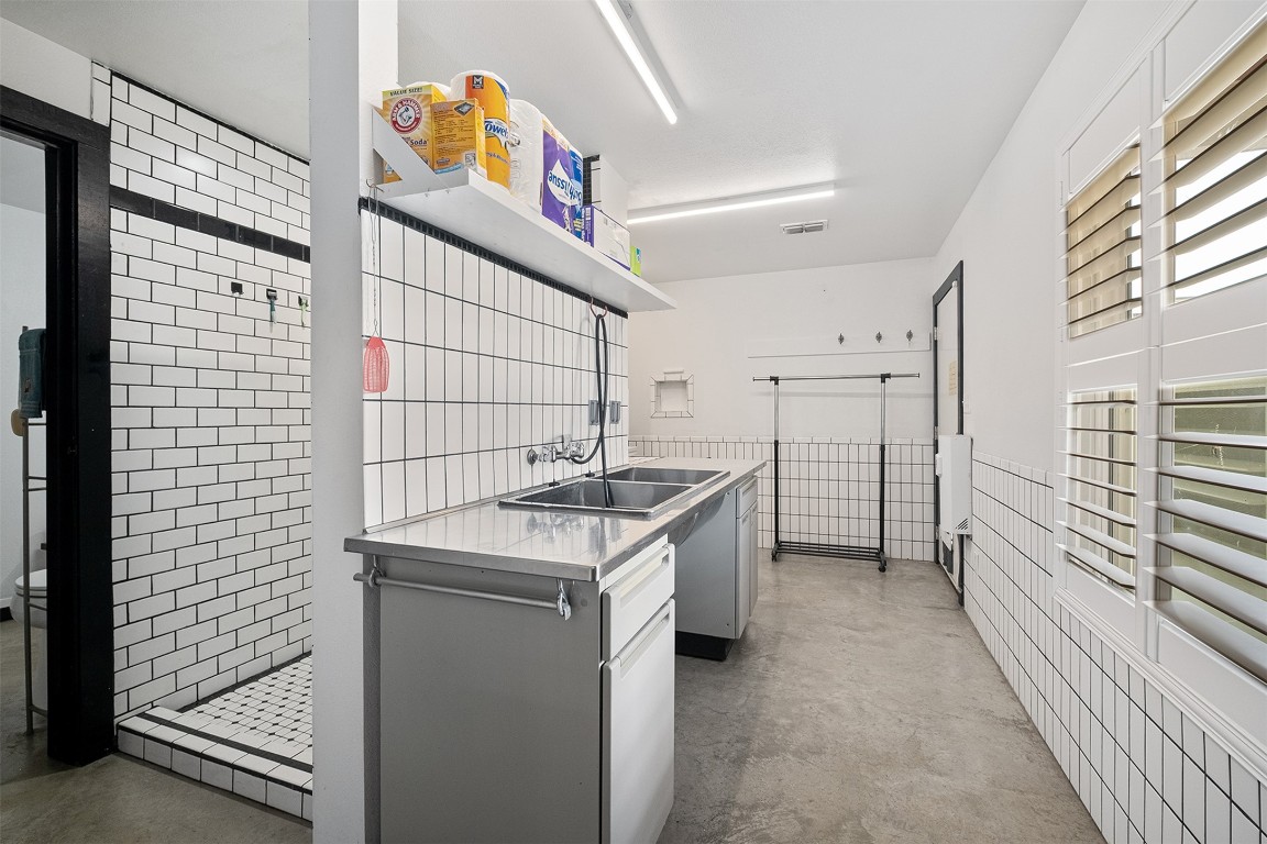 142 Zimmerhanzel Road Flatonia, TX 78941 - Photo 21 of 40 a kitchen that has a sink and a stove