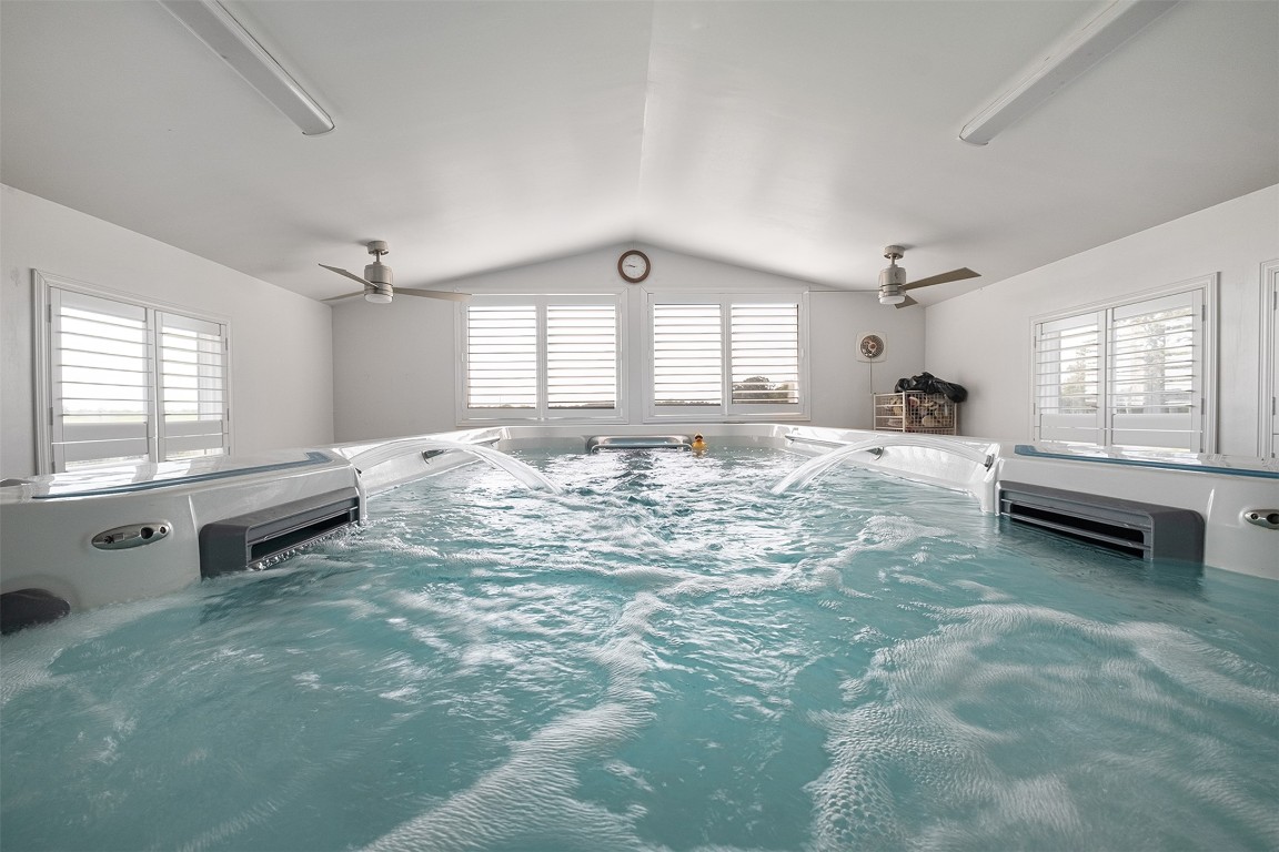 142 Zimmerhanzel Road Flatonia, TX 78941 - Photo 26 of 40 a large spacious bedroom with a bed and a large window