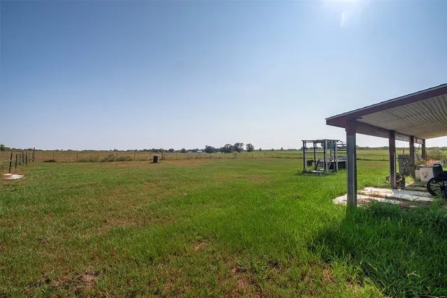 a view of a lake with houses in the background