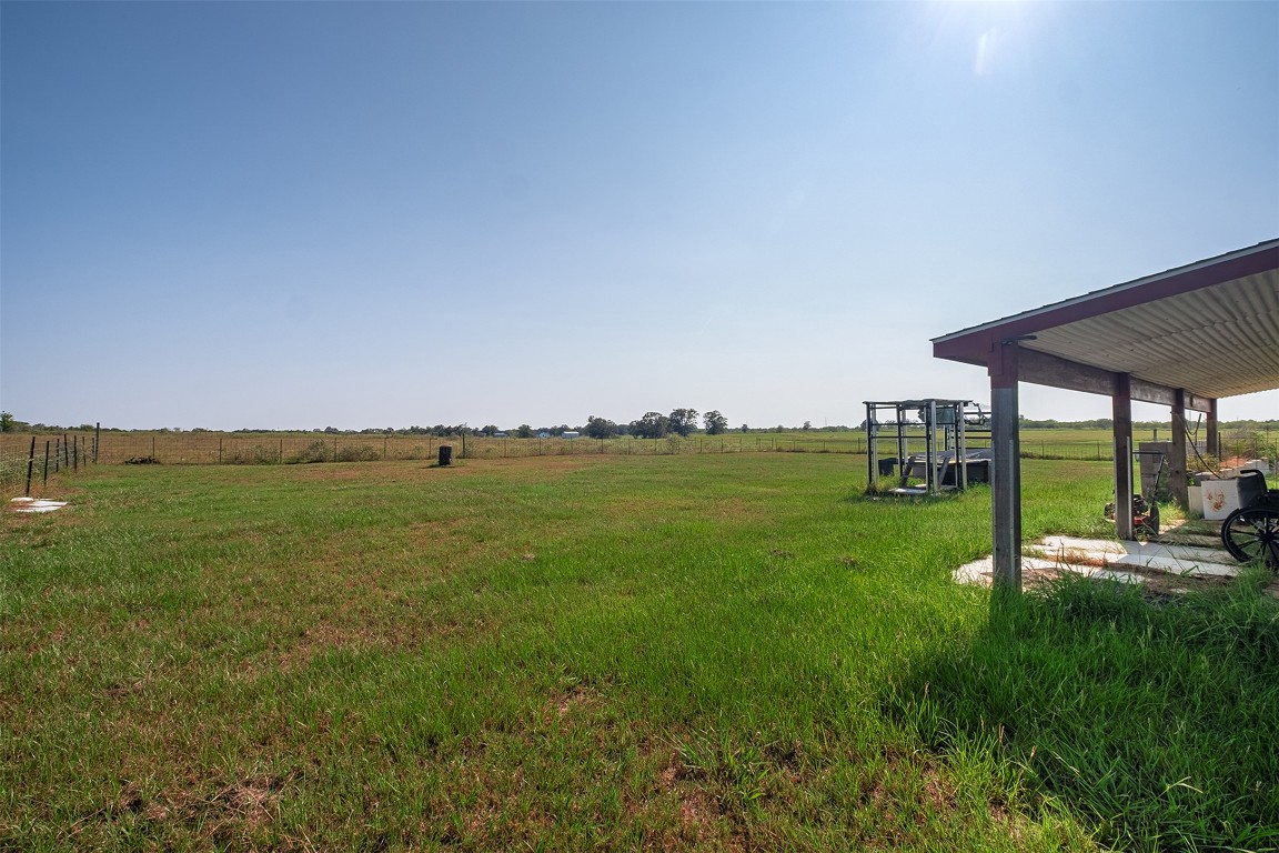 142 Zimmerhanzel Road Flatonia, TX 78941 - Photo 37 of 40 a view of a green field with sitting area