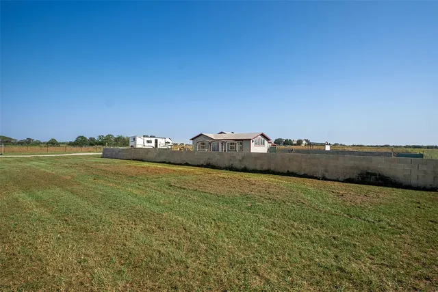 a view of outdoor space with deck and yard