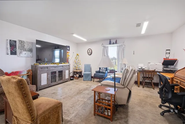 a room with a bed and furniture