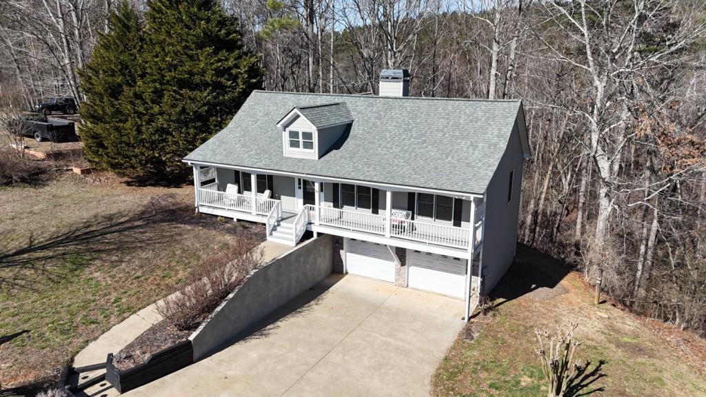 165 Horseshoe Bend Jasper, GA 30143 - Photo 39 of 44 a view of a house with a wooden deck and a forest