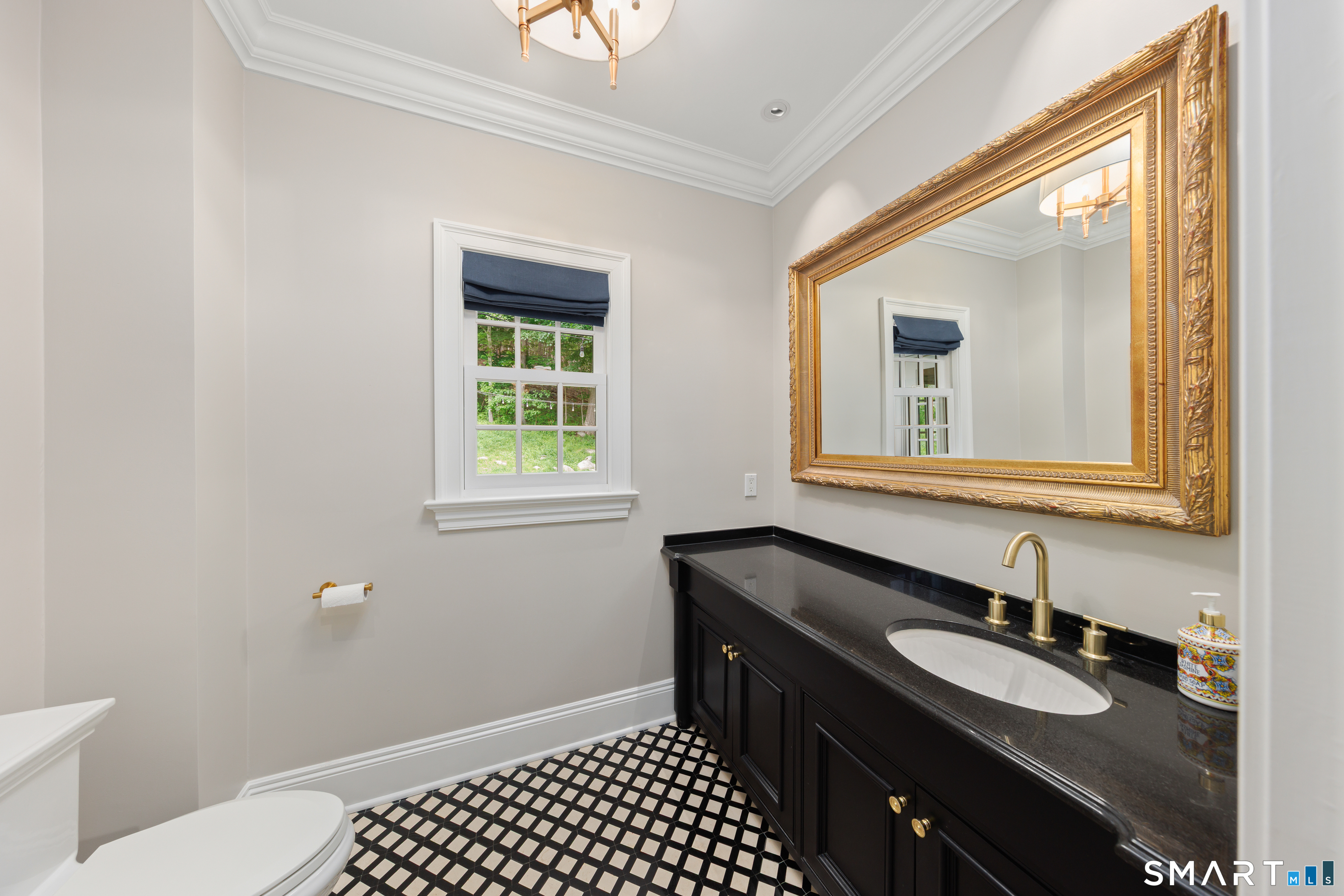 99 Hickok Road New Canaan, CT 06840 - Photo 14 of 39 a bathroom with a sink and a mirror