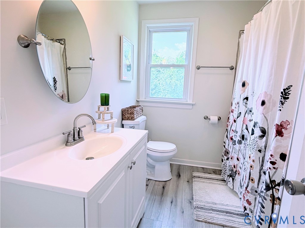 7547 Media Park Road Henrico, VA 23231 - Photo 11 of 21 Bathroom featuring a single-sink vanity with white