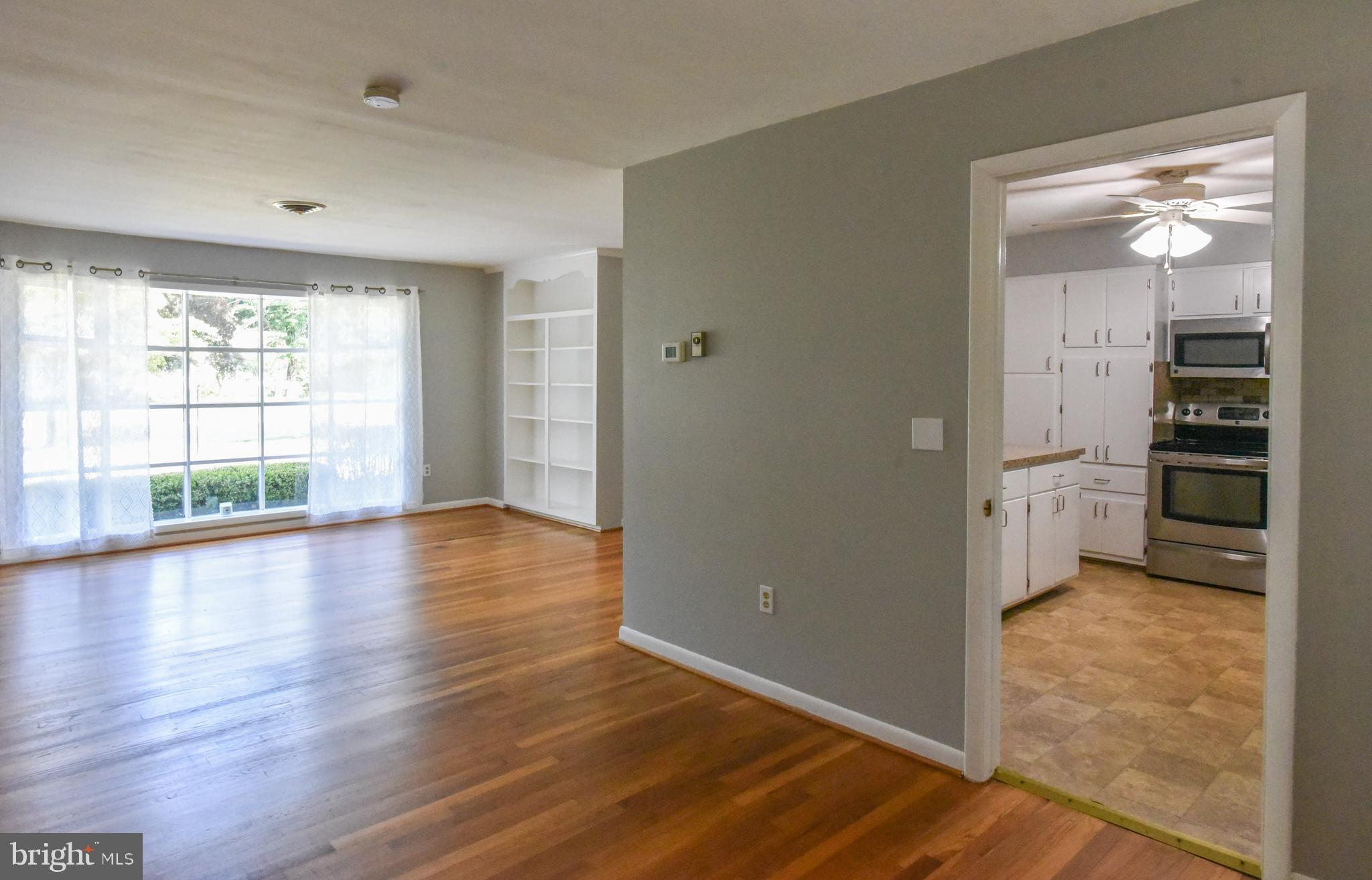 820 Riverside Drive Salisbury, MD 21801 - Photo 5 of 31 Dining room off kitcehn, living room with windows!