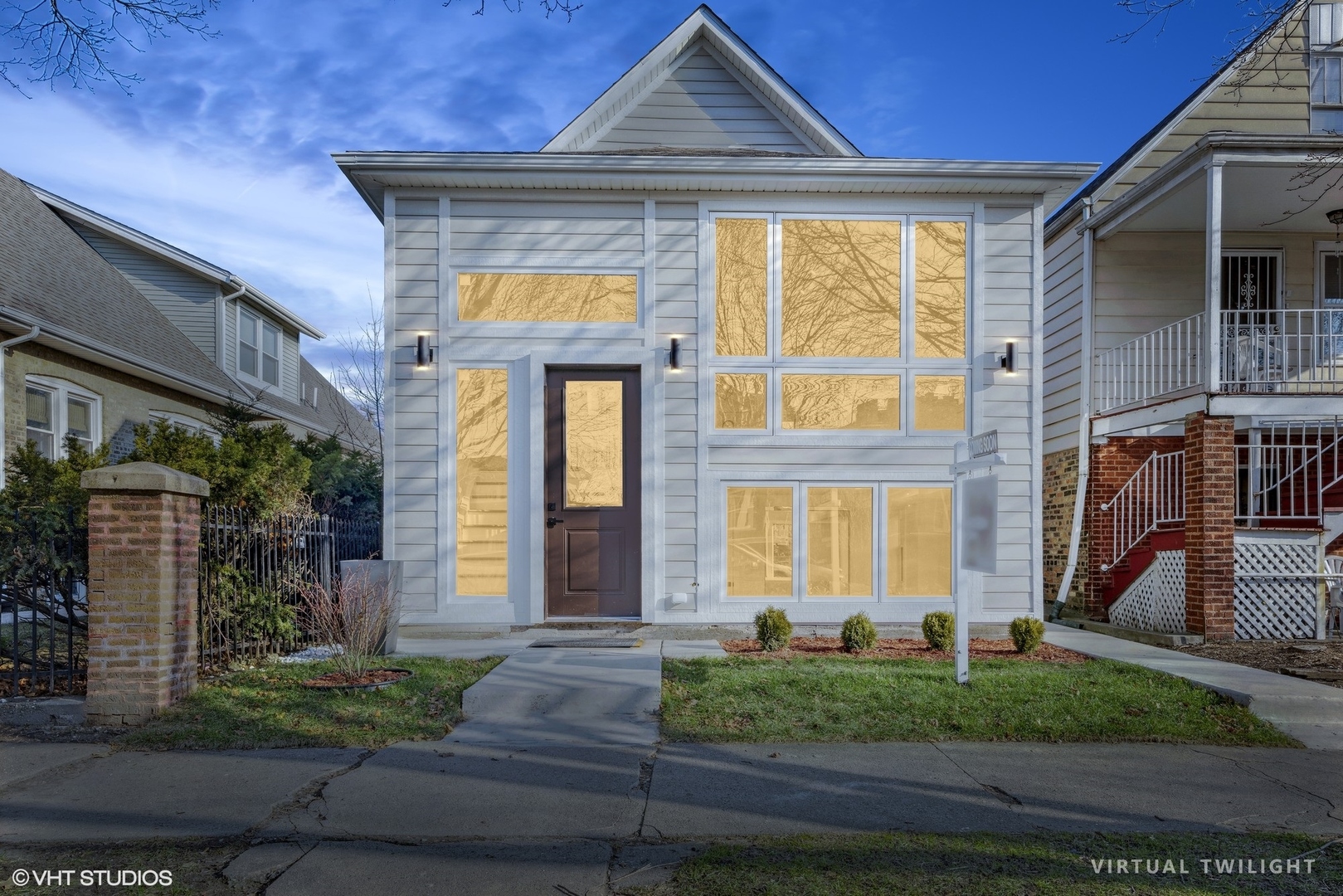 a front view of a house with garden