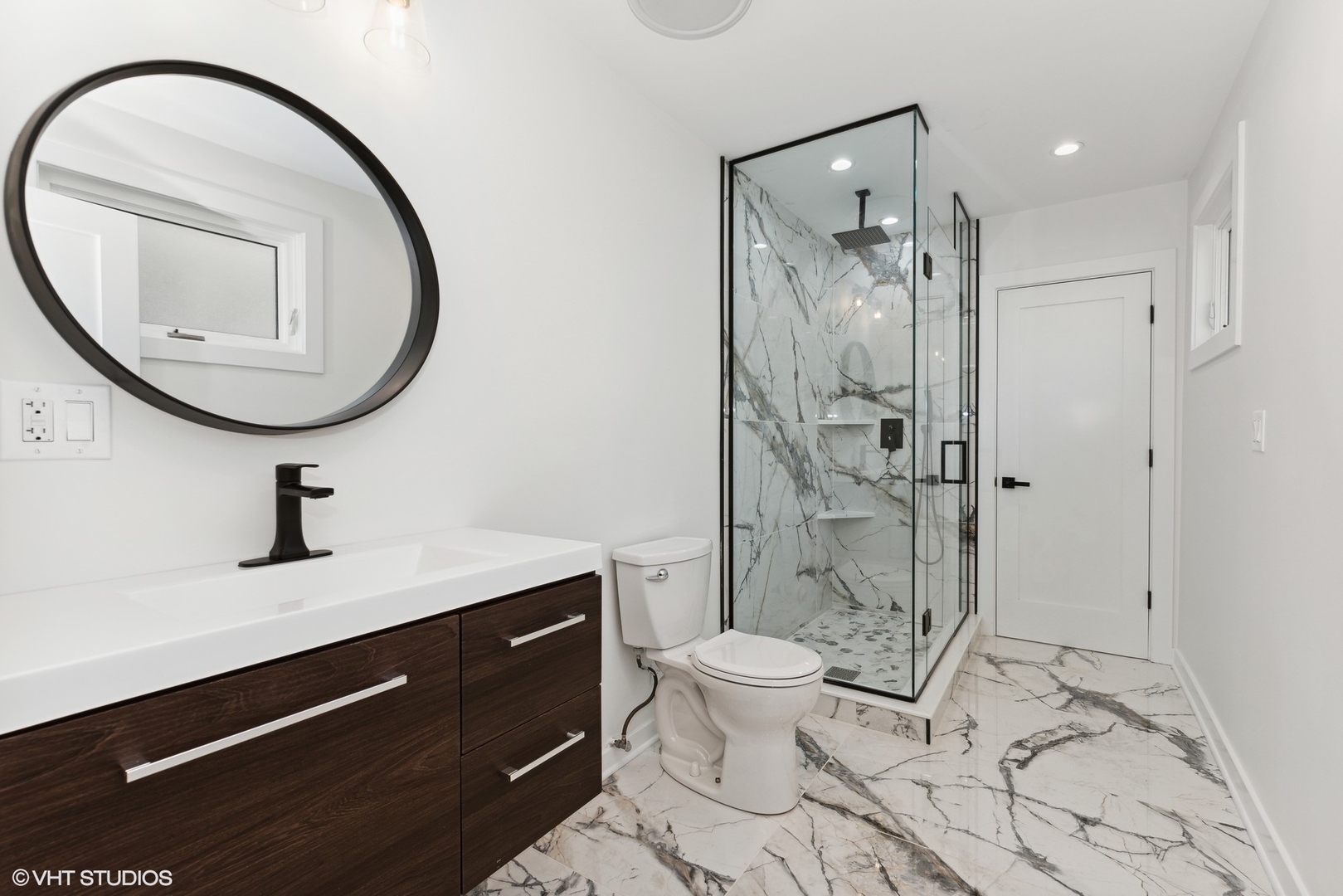 1025 Dewey Avenue Evanston, IL 60202 - Photo 12 of 21 a bathroom with a sink a toilet and a mirror