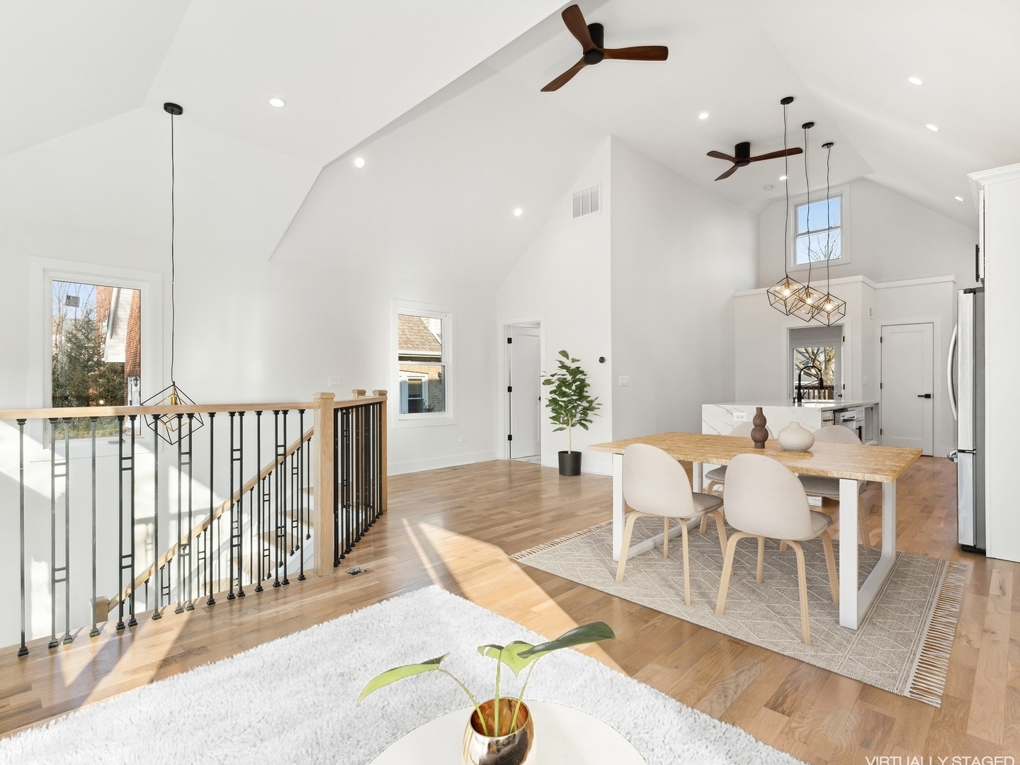 1025 Dewey Avenue Evanston, IL 60202 - Photo 2 of 21 a view of a dining room and livingroom with furniture wooden floor a chandelier