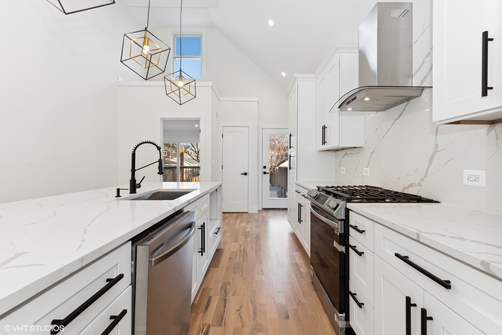 1025 Dewey Avenue Evanston, IL 60202 - Photo 6 of 21 a kitchen with stainless steel appliances a sink dishwasher and a stove with wooden floor