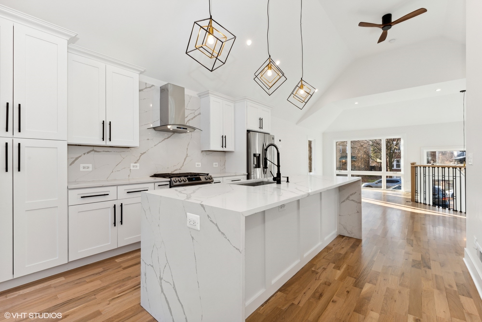 1025 Dewey Avenue Evanston, IL 60202 - Photo 7 of 21 a kitchen with stainless steel appliances a white stove top oven a sink dishwasher and white cabinets with wooden floor