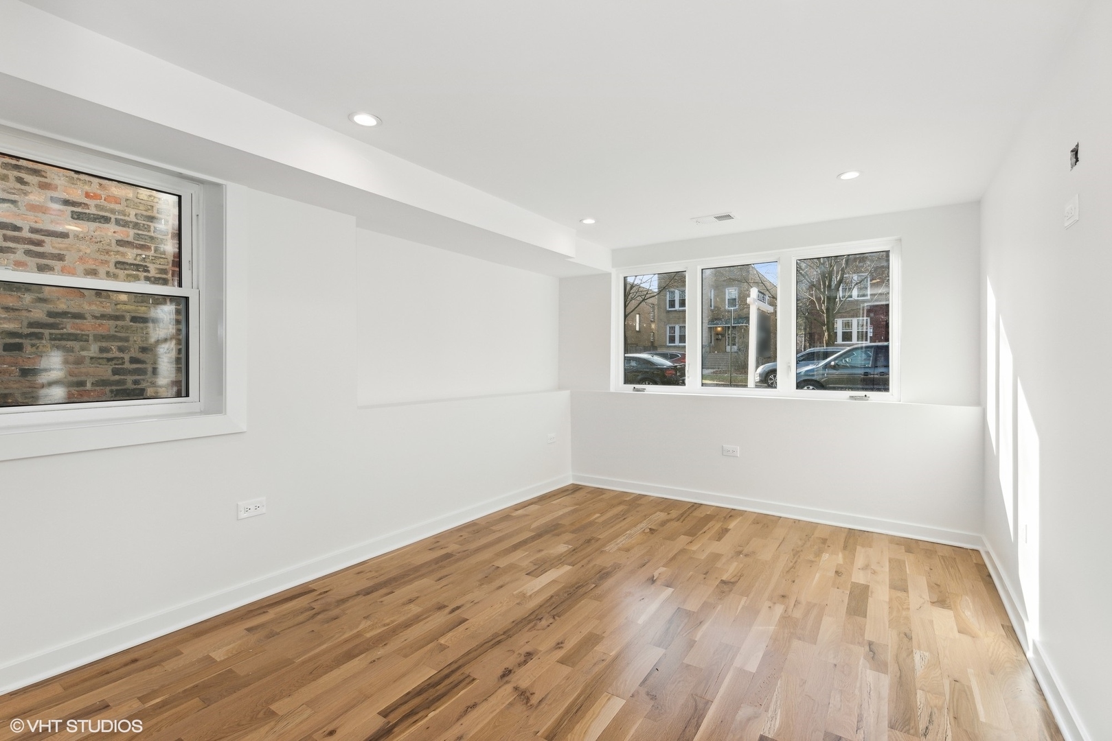 1025 Dewey Avenue Evanston, IL 60202 - Photo 9 of 21 a view of an empty room with wooden floor and a window