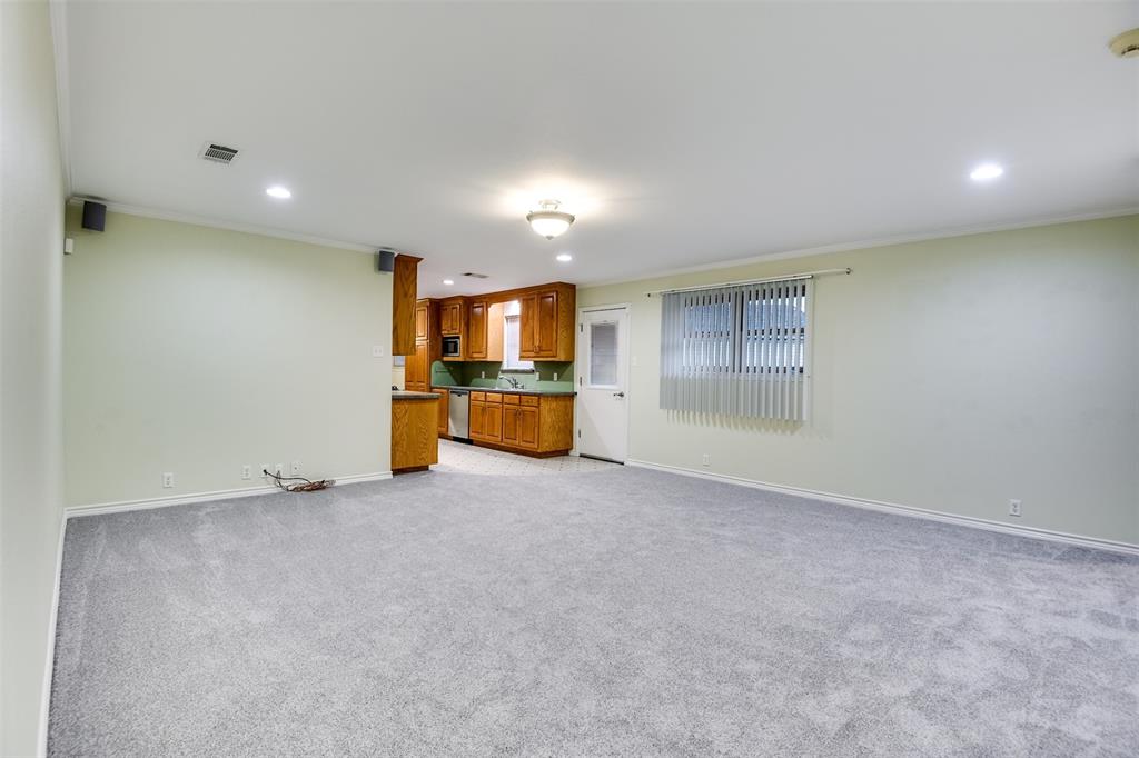 802 Cardinal Road Mansfield, TX 76063 - Photo 12 of 31 Unfurnished living room with recessed lighting, ornamental molding, and light colored carpet