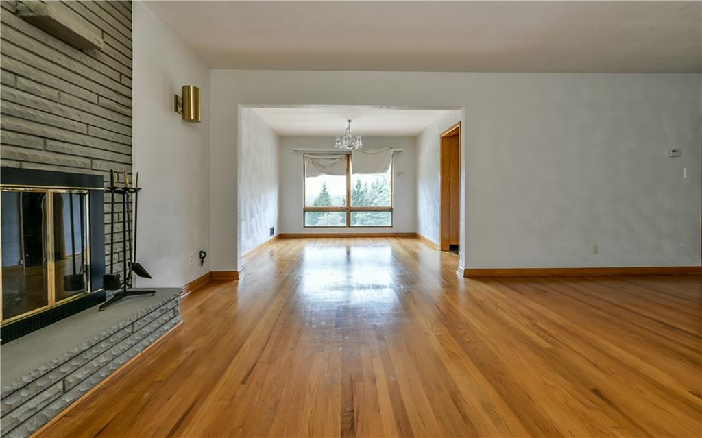 3891 Anderson Road Gibsonia, PA 15044 - Photo 5 of 22 Living room with view of dining room and large windows overlooking yard.