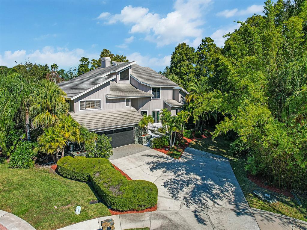 1609 Hampton Court Safety Harbor, FL 34695 - Photo 3 of 78 a view of a house with a yard and garden