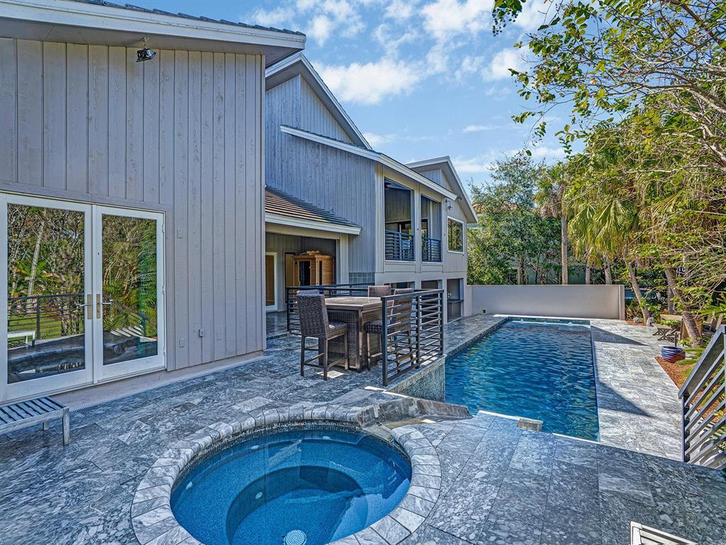 1609 Hampton Court Safety Harbor, FL 34695 - Photo 40 of 78 a view of a house with backyard porch and sitting area