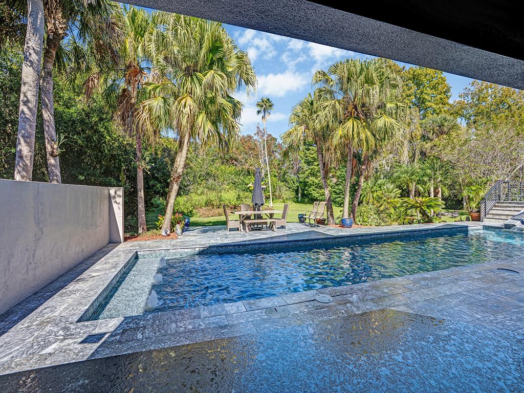 1609 Hampton Court Safety Harbor, FL 34695 - Photo 42 of 78 a view of a yard with wooden fence
