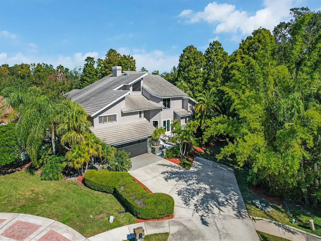 1609 Hampton Court Safety Harbor, FL 34695 - Photo 5 of 78 a aerial view of a house with a yard and potted plants