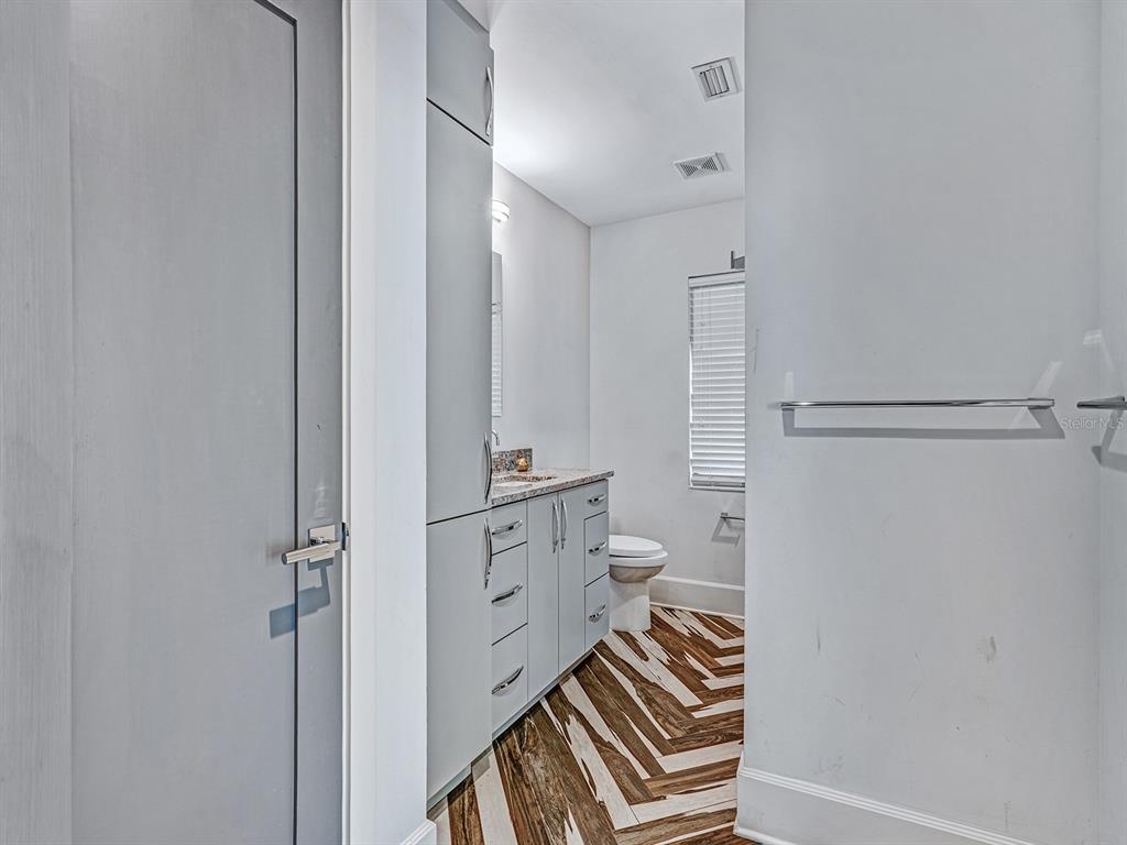 1609 Hampton Court Safety Harbor, FL 34695 - Photo 52 of 78 a bathroom with a sink a mirror and a shower