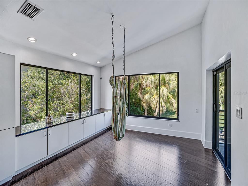 1609 Hampton Court Safety Harbor, FL 34695 - Photo 60 of 78 a view of an empty room with wooden floor and a window