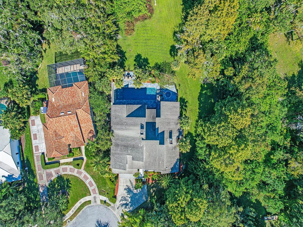 1609 Hampton Court Safety Harbor, FL 34695 - Photo 6 of 78 an aerial view of a house with outdoor space and trees all around