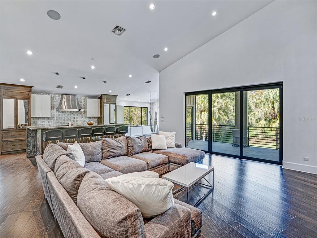 1609 Hampton Court Safety Harbor, FL 34695 - Photo 66 of 78 a living room with furniture and a large window