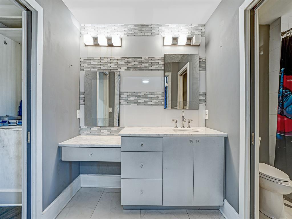 1609 Hampton Court Safety Harbor, FL 34695 - Photo 73 of 78 a bathroom with a sink double vanity and a toilet