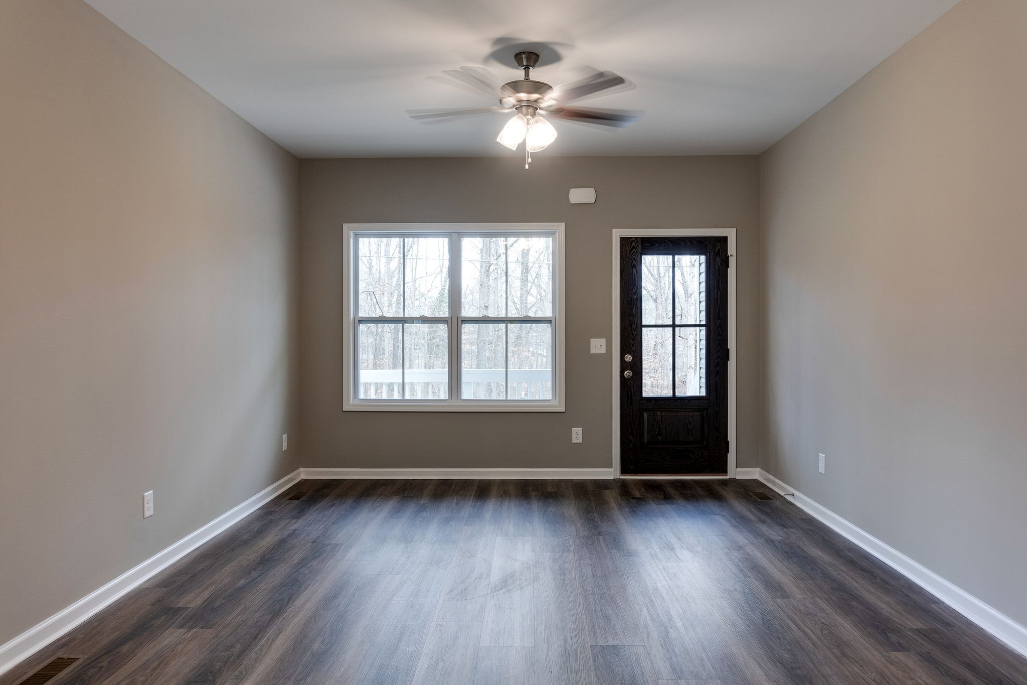 116 Shane-Lee Circle Dover, TN 37058 - Photo 3 of 33 an empty room with wooden floor and windows