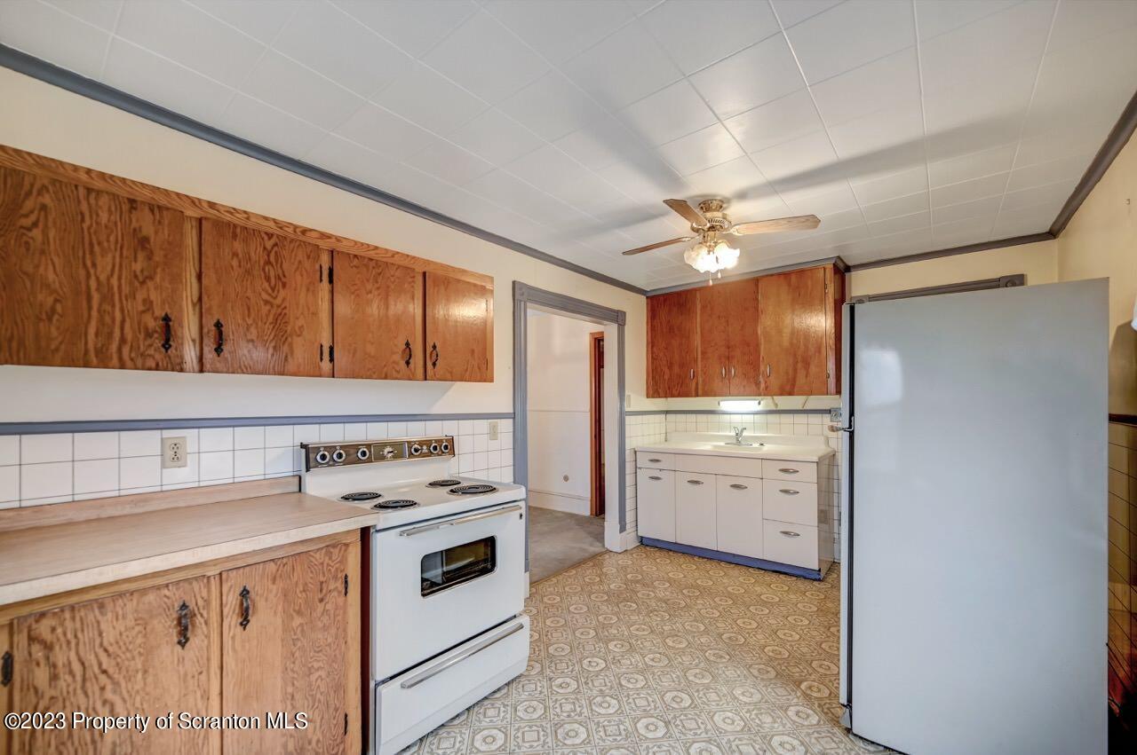 5 East Mountain Road Scranton, PA 18505 - Photo 44 of 88 a kitchen with cabinets stainless steel appliances and a window