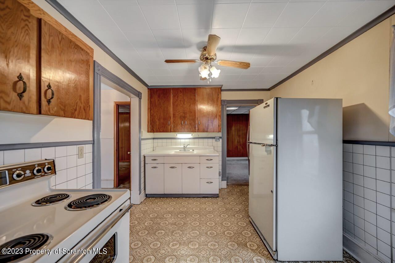 5 East Mountain Road Scranton, PA 18505 - Photo 45 of 88 a kitchen that has a lot of cabinets stainless steel appliances and a refrigerator