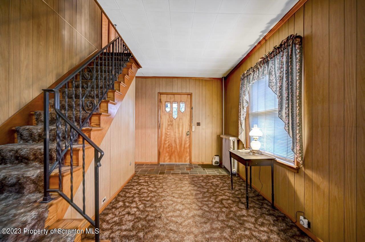 5 East Mountain Road Scranton, PA 18505 - Photo 6 of 88 a view of a hallway with wooden floor and staircase