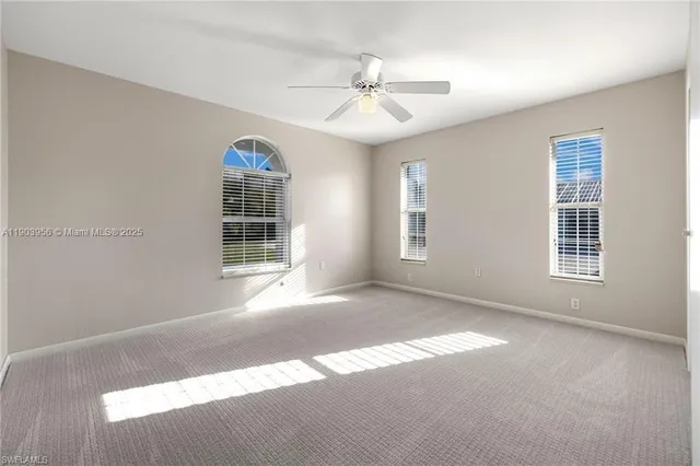 a view of livingroom with window ceiling fan and hardwood floor