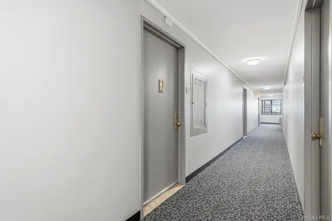 a bathroom with a shower and a glass door