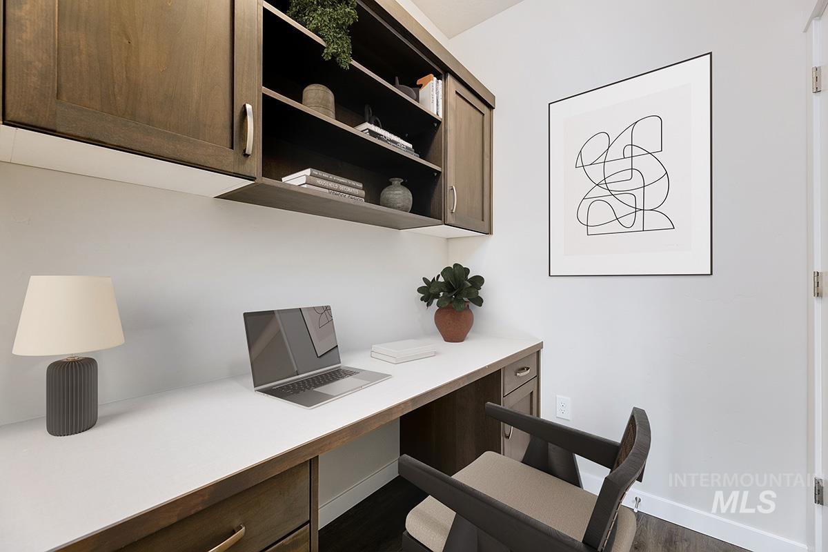 219 West Broyhill Street Meridian, ID 83642 - Photo 10 of 25 Office area with built in desk and dark wood-type flooring