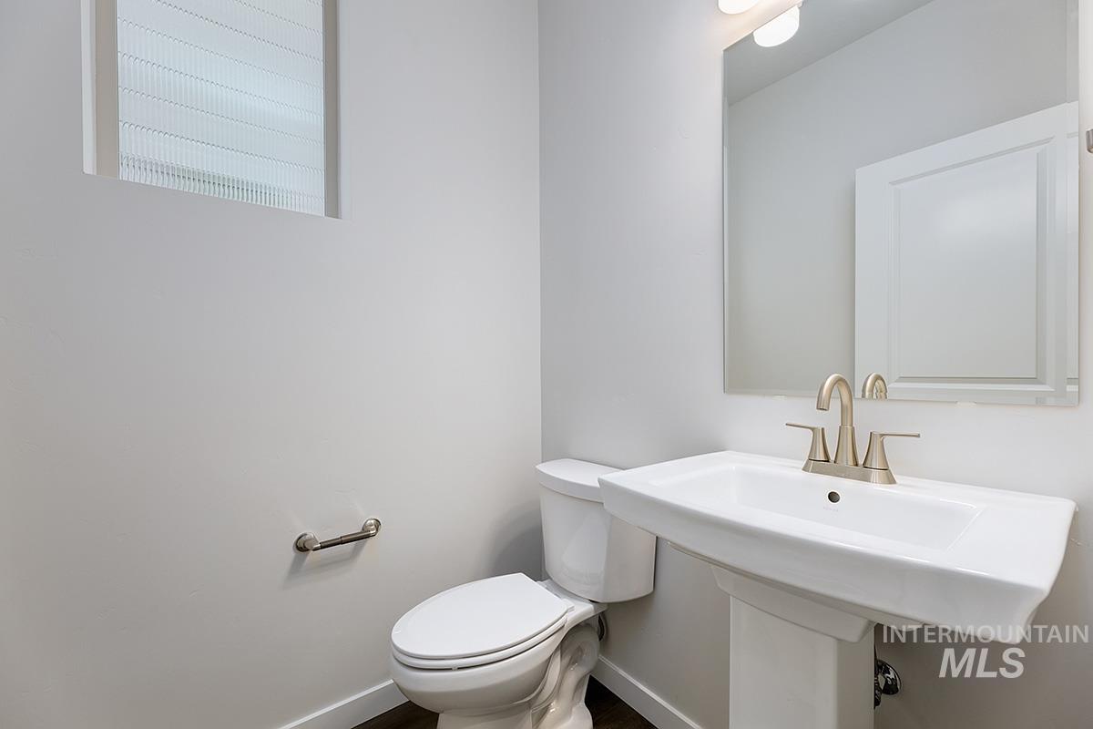 219 West Broyhill Street Meridian, ID 83642 - Photo 11 of 25 Half bath featuring toilet and baseboards