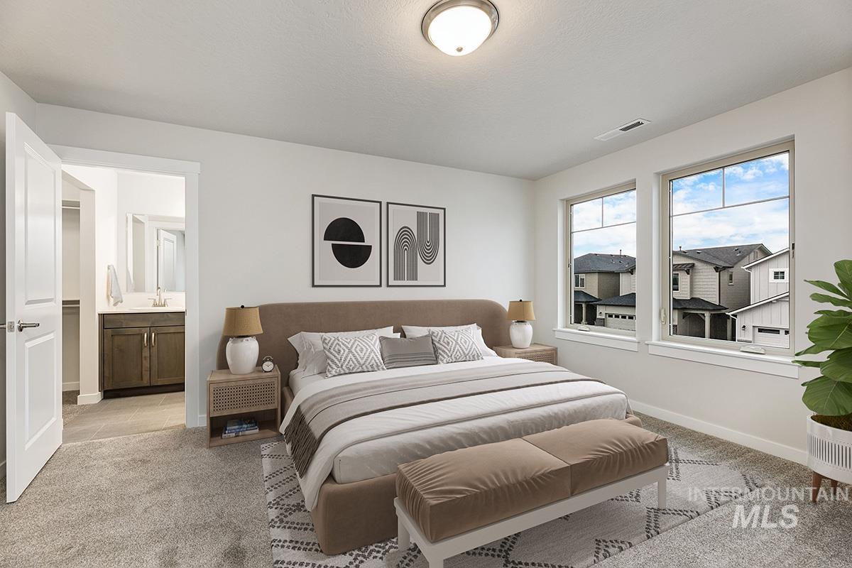 219 West Broyhill Street Meridian, ID 83642 - Photo 12 of 25 Bedroom featuring light colored carpet and ensuite bath