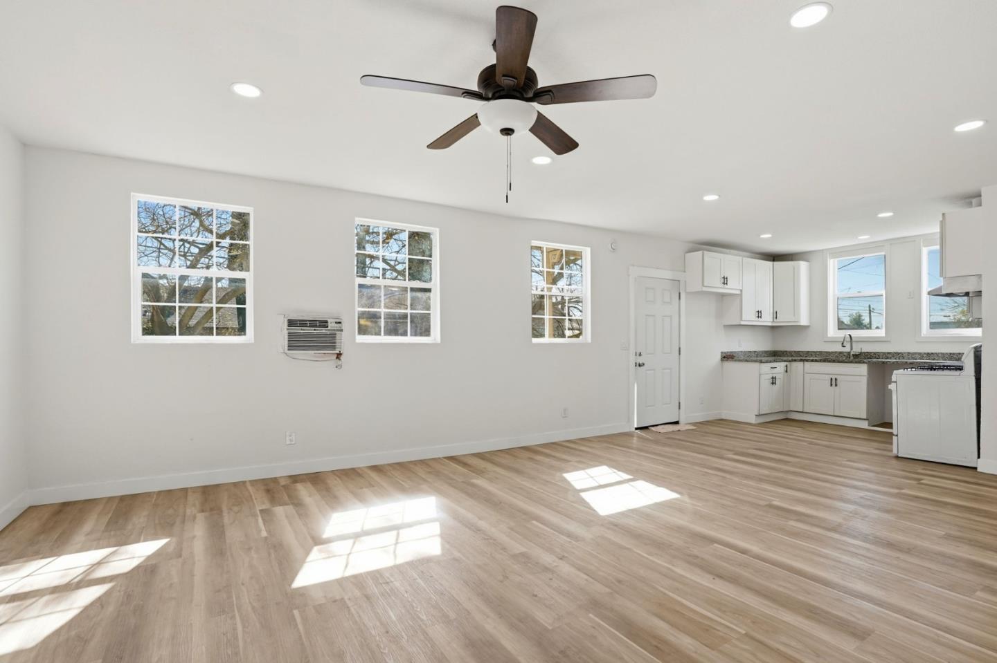 345 South Pilgrim Street Stockton, CA 95205 - Photo 11 of 27 a view of empty room with wooden floor and window