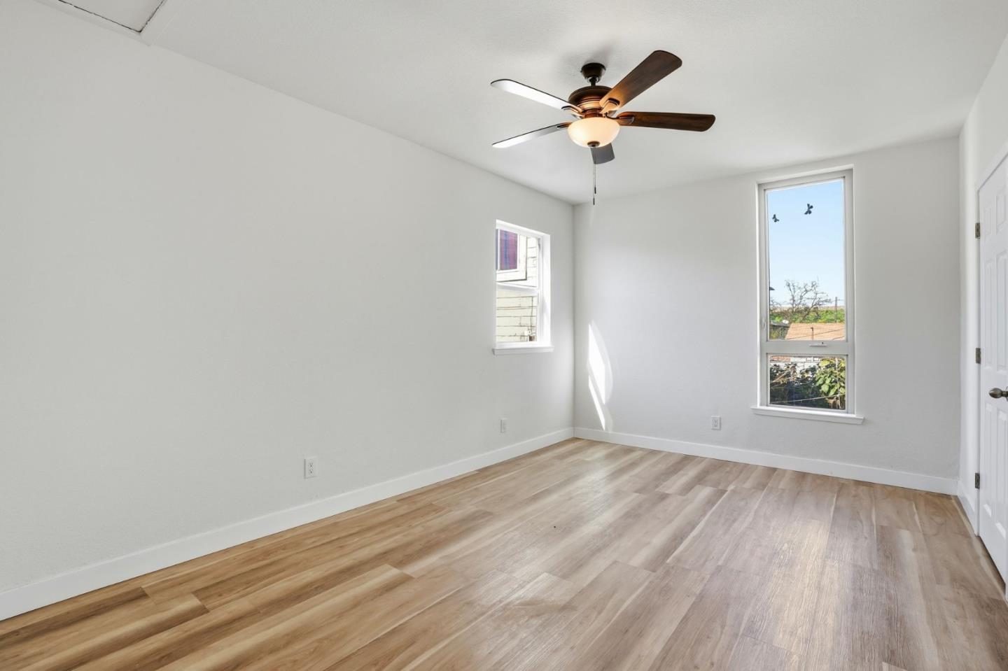 345 South Pilgrim Street Stockton, CA 95205 - Photo 12 of 27 wooden floor in an empty room with a window