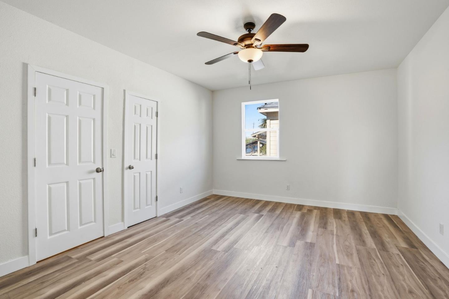 345 South Pilgrim Street Stockton, CA 95205 - Photo 15 of 27 wooden floor in an empty room with a window