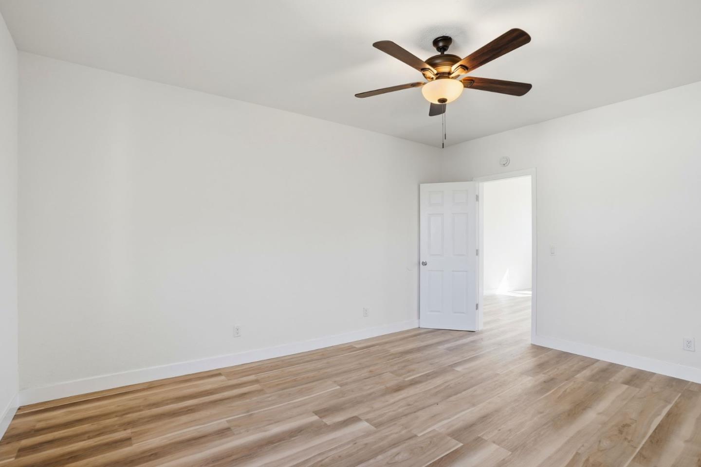 345 South Pilgrim Street Stockton, CA 95205 - Photo 17 of 27 an empty room with ceiling fan and window